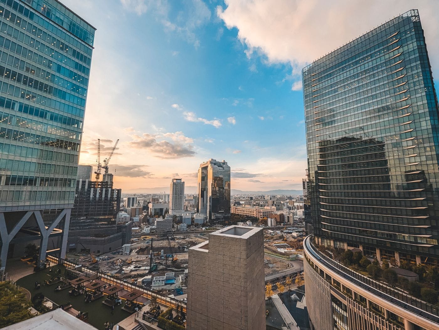 A breathtaking cityscape of Osaka, Japan showcasing skyscrapers at sunset.