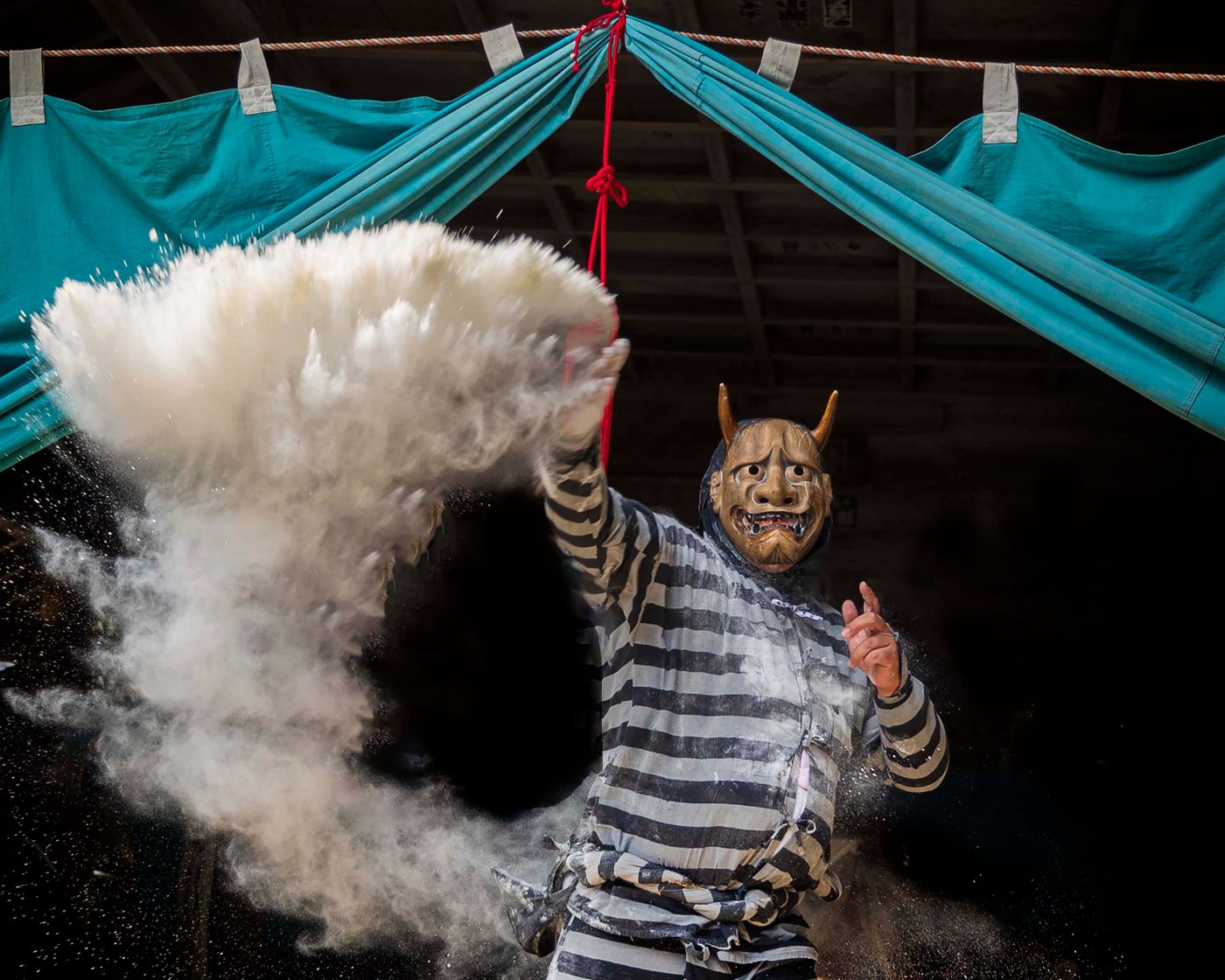 Masked performer in traditional Japanese festival in Toyohashi, Aichi, Japan.