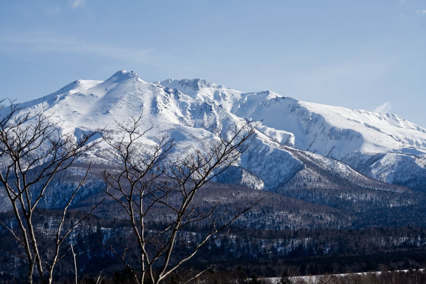 Snowcapped Asahi-Dake stands majestically in Daisetsuzan National Park, Hokkaido, Japan.