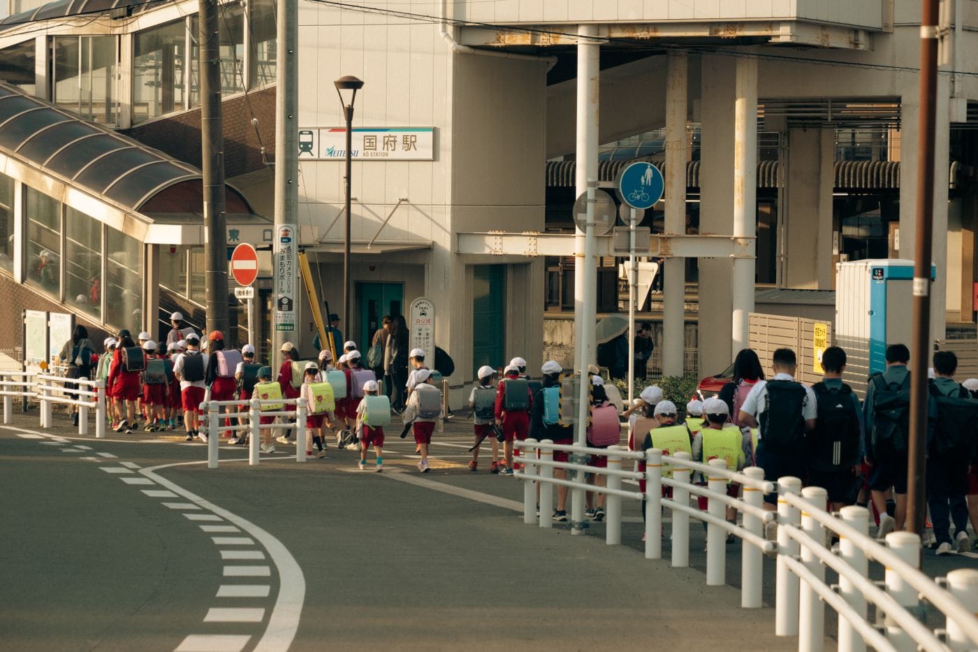 Group of children walking near a train station in Toyokawa, Aichi, Japan.