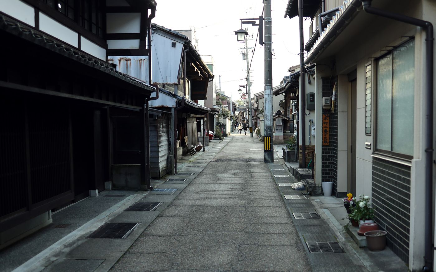 Quaint and serene Japanese street with traditional architecture, captured at twilight.