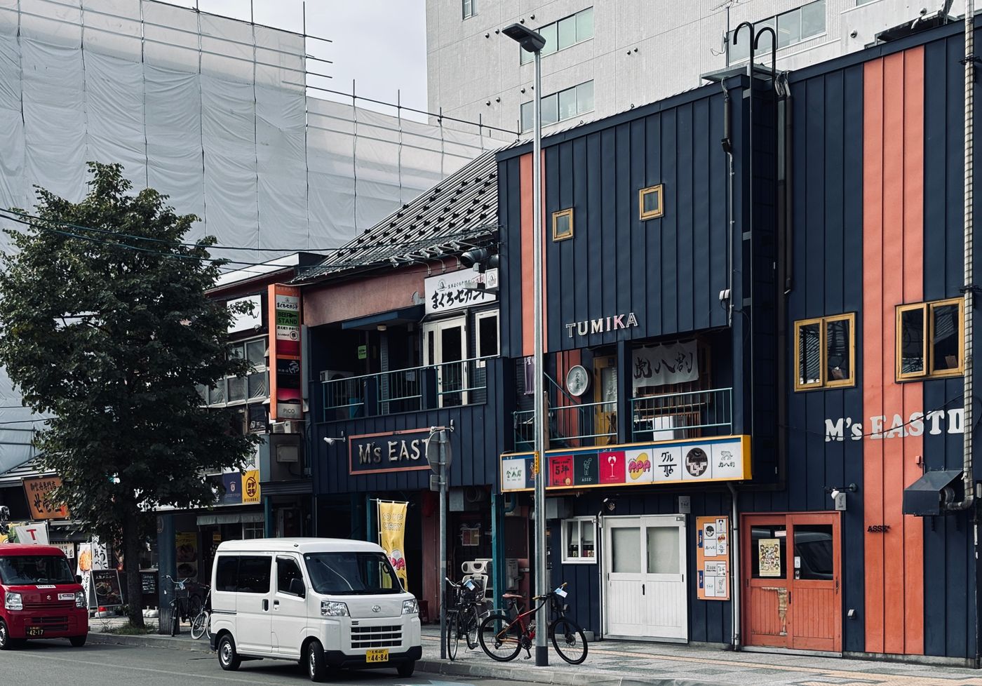 Vibrant buildings and urban street in Sapporo, Japan showcasing local architecture and city life.