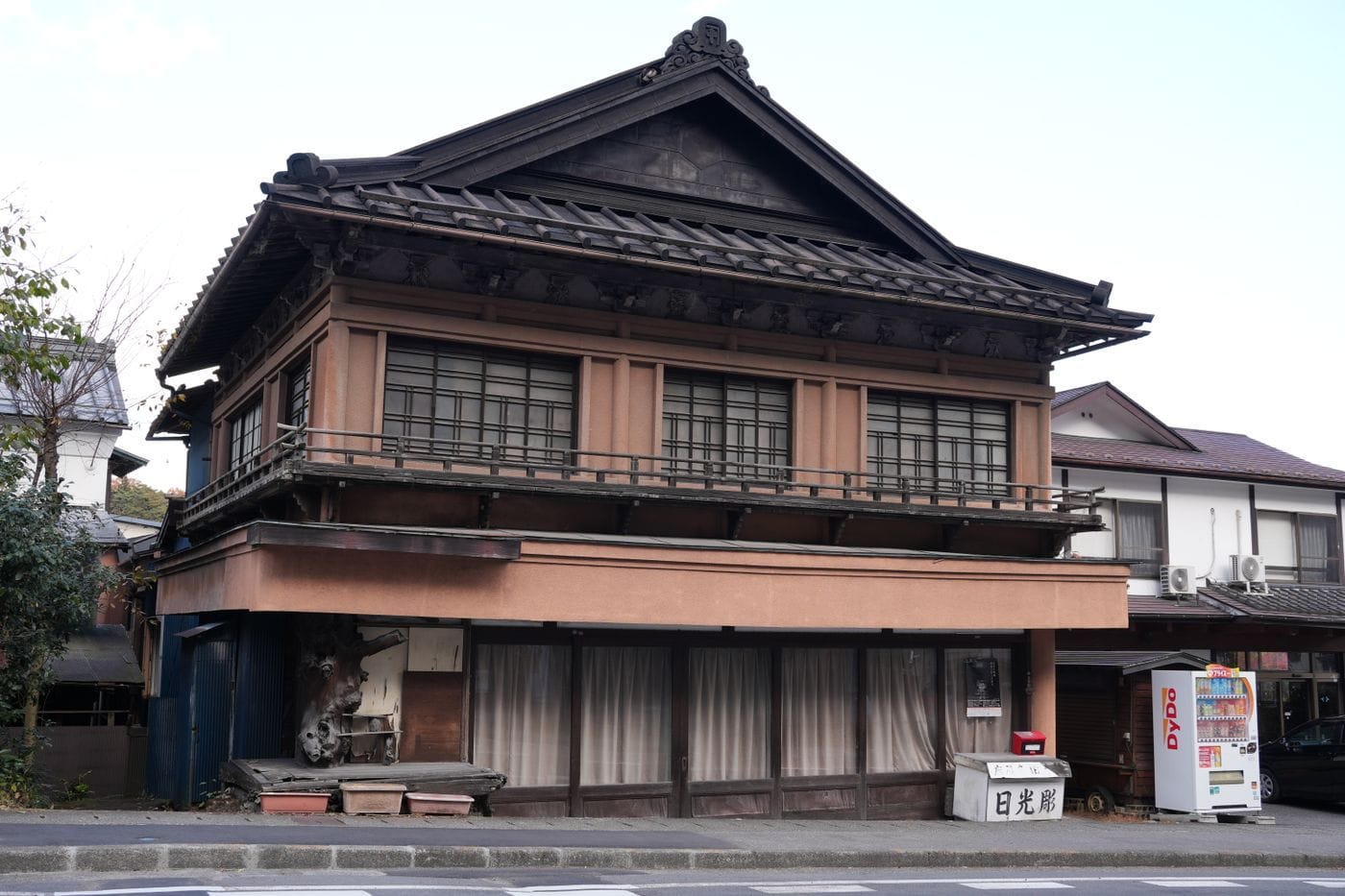 Classic Japanese architecture showcased in a wooden building on a quiet street in Nikko, Tochigi.