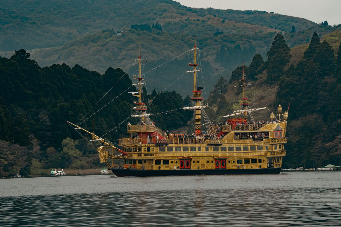 Vintage-style pirate ship cruising on Lake Ashi amid Hakone's scenic mountains.