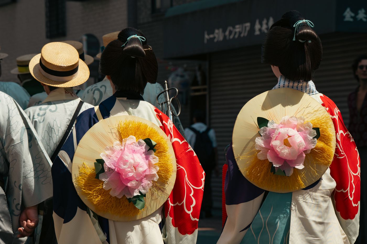 Traditional festival in Tokyo featuring kimonos and floral designs.