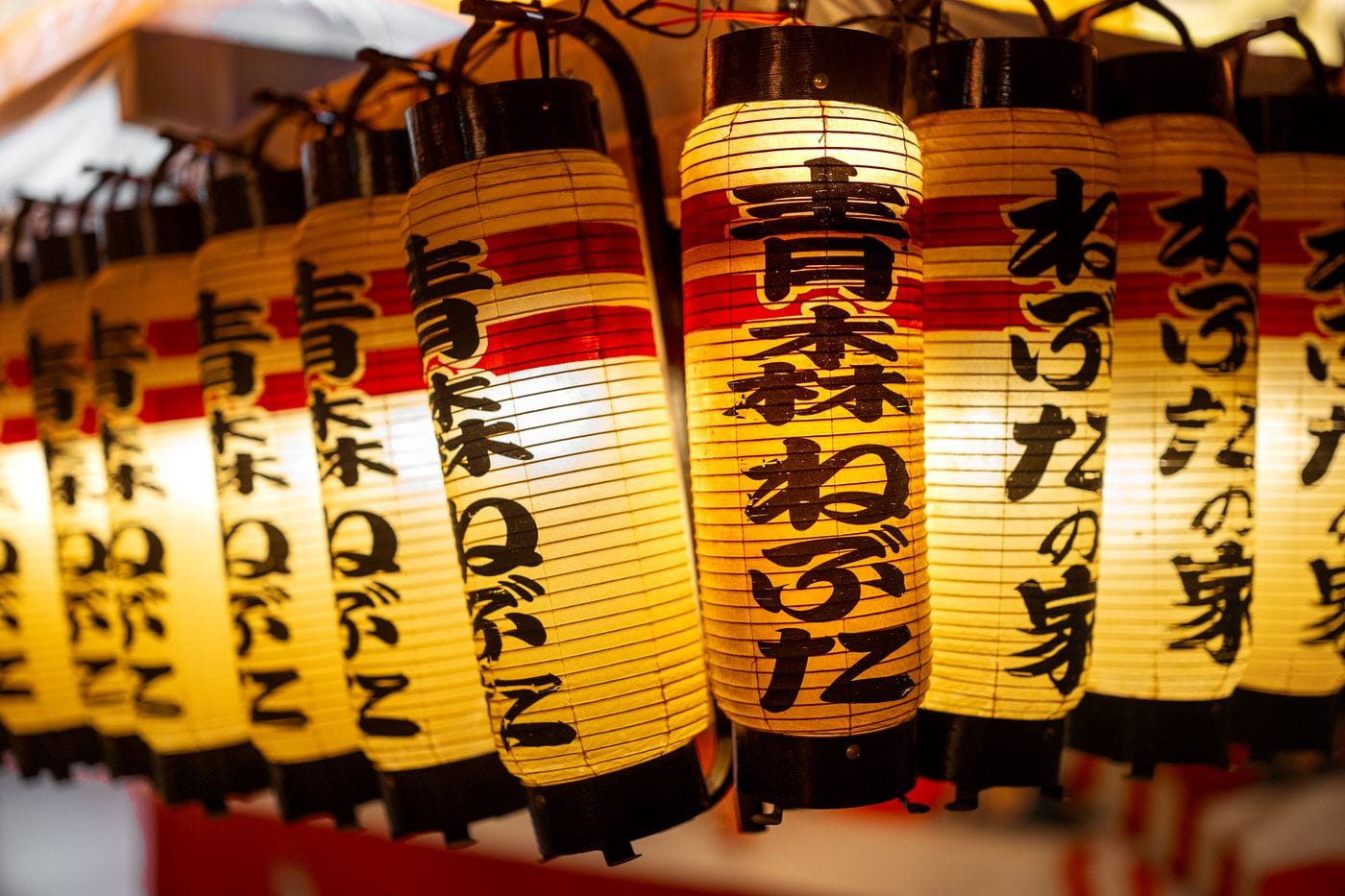 Close-up of illuminated paper lanterns at the Nebuta Festival in Aomori, Japan, showcasing Japanese cultural art.