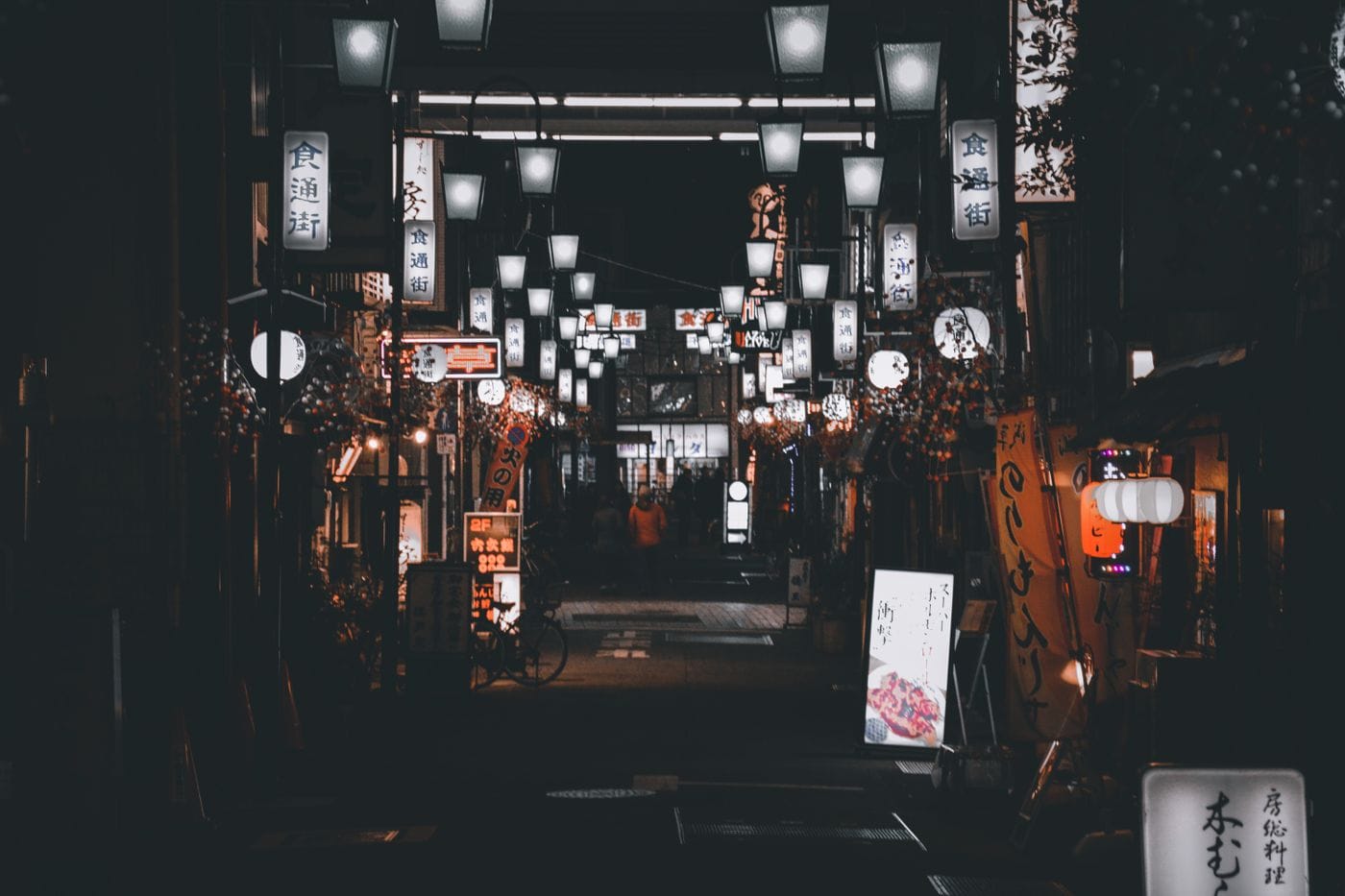 A picturesque night street in Japan, adorned with traditional lanterns creating a serene atmosphere.